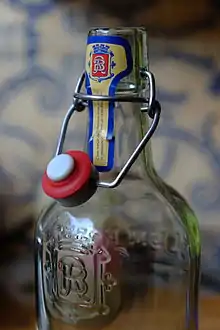 An opened flip-top bottle closure