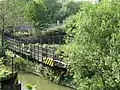 The swing bridge in the open position on the north bank of the Sheepwash Channel.