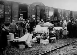 People being deported in cattle wagons cars during World War II