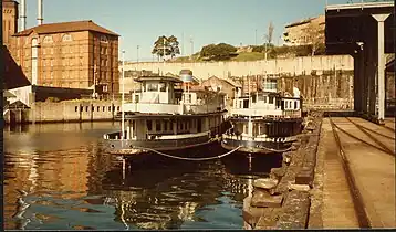 Kameruka (left) laid up alongside Karrabee at Pyrmont, 1984