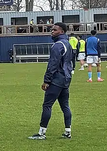 The player on the pitch during warm-up