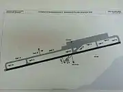 A map showing the runway, taxiways and other structures of the airport.