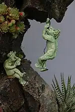 Sculpted ceramic figurines for bonsai scenes.