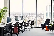 large open plan office with floor to ceiling windows