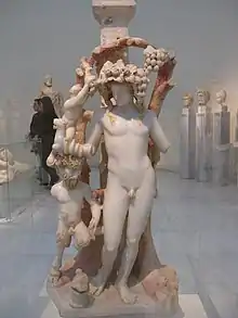 Marble table support adorned by a group including Dionysos, Pan and a Satyr, 170-180 AD