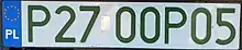 A single-row registration plate reading P27-00P05 in green-tinted letters.