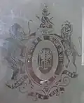 The Coat of Arms of Maharaja Gopal Lal Roy as depicted on a ground floor French Door window panel