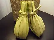 Leaf-wrapped rice dish (nasi kuning)