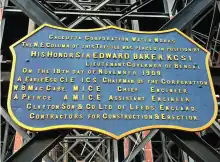 badge shaped plaque with details of foundation of the tank