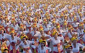 Balinese Tari tenun (weaving dance) mass dance, performed by hundreds of dancers.