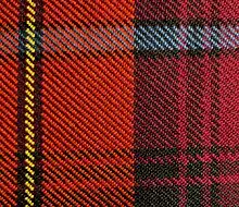Close-up view of scarlet red, black, yellow, azure bleu, and crimson red tartan cloth