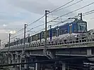 A 3000 class (RT8D5M) train passing at the Ortigas Interchange (October 2022)