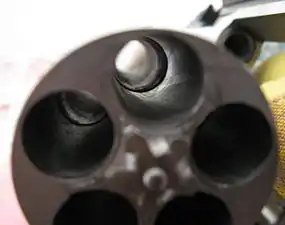 Closeup of the cylinder (carbine model pictured), showing the choked chambers that prevent adding .454 Casull rounds on non-magnum models.