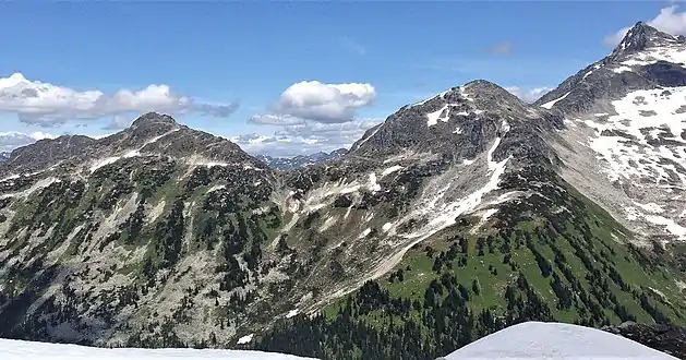 South aspect of Mount Taylor (left), Tszil Mountain (right of center), Slalok Mountain (upper right corner)