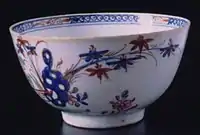 Tea bowl, c. 1770, Redgrave type, combining underglaze blue with overglaze decoration, and touches of gilding.