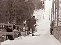 An athlete about to descend the inrun in Planica, 1960