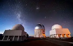 The gleaming dome of the Víctor M. Blanco Telescope is flanked by two telescopes of the SMARTS Consortium in this image from Cerro Tololo Inter-American Observatory