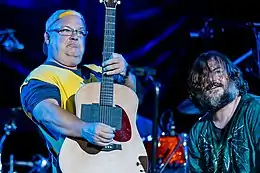 Tenacious D playing guitars onstage