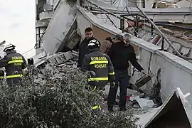 Search and rescue team from Romania working on a collapsed building