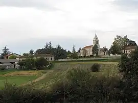 The church and surrounding buildings in Thézac