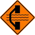 Bridge out ahead with a temporary bridge on a detour on left