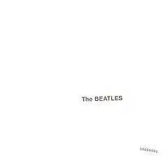 The words "The Beatles" embossed on a plain white background, with a serial number in the lower right