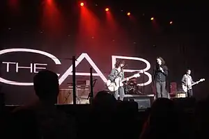 A band performs for a live audience.