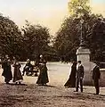 An evening stroll in the 19th century at the entrance of the Alameda Gardens.