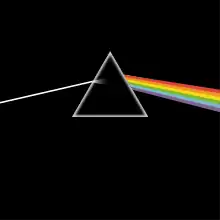 Original album artwork featuring an almost black cover with a triangular prism in the middle. A ray of white light enters the prism from the left and is refracted into colours as it comes out the right side.