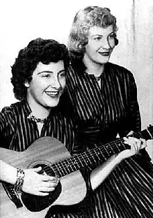 Betty Jack (left, holding guitar) and Skeeter Davis