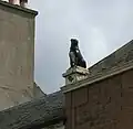 The "Girnin Dug" statue of a dog erected as a reproach to a neighbour suspected of poisoning the pet