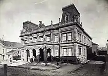 The Károlyi Palota, Pollack Mihály tér, (Miklós Ybl, 1865), in 1881.  On the left of the building are the National Stables, demolished after the war and replaced with a five-story building in 1969.