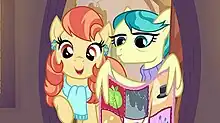 Aunt Holiday (left) with Auntie Lofty, who is holding a quilt with her wings that contains various cutie marks