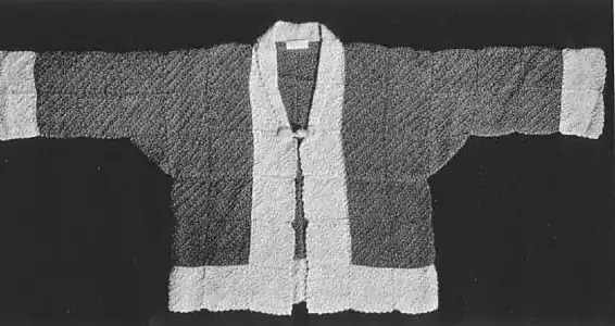 Coat from a 1938 patternbook. Seams between squares can be seen. Note rectangular garment construction, with underarm gussets made from squares folded on the diagonal, and tarikubi collar.