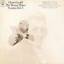 an album cover with a light tan background and faint illustrations of a bird flying leftward and the composer Mozart