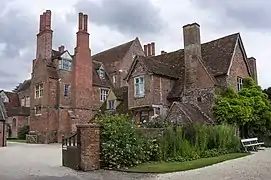 The old manor house with the Elizabethan Mapledurham House in the background