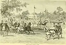 People on horseback and riding in carriages in the park
