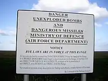 A warning sign posted "By Command of the Defence Council".