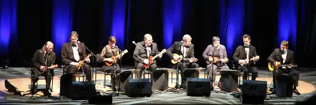 The Ukulele Orchestra of Great Britain performing in 2014, with co-founder Kitty Lux