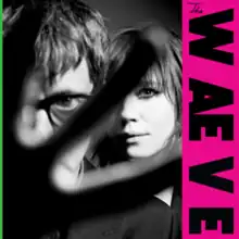 A black-and-white photo of the duo partly obscured by a hand covering the lens. "The Waeve" is written in a vertical space along the right side.