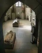 Tomb effigy of Jean d'Aluye (foreground), French, 13th century. Now in The Cloisters, New York