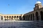 Courtyard of the mosque, looking east, with the entrance to the prayer hall on the right