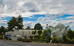 Tīrau's corrugated iron 'giant dog' and 'big sheep' buildings