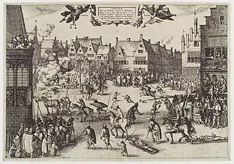 A busy urban scene. Medieval buildings surround an open space, in which several men are being dragged by horses. One man hangs from a scaffold. A corpse is being hacked into pieces. Another man is feeding a large cauldron with a dismembered leg.  Thousands of people line the streets and look from windows.  Children and dogs run freely.  Soldiers keep them back.