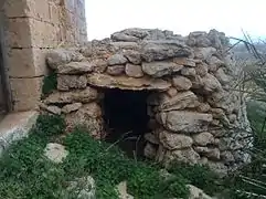 The girna at the side of the farmhouse