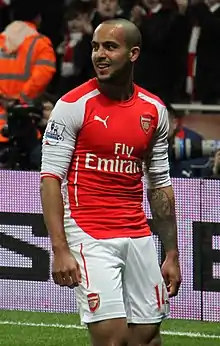 A man in a football uniform, playing in a football match