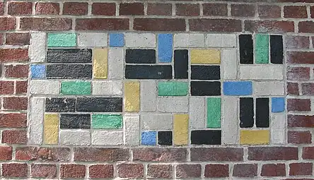 De Stijl - Panel of polychrome bricks on the exterior of the Vakantiehuis De Vonk, a house in Noordwijkerhout, the Netherlands, by Theo van Doesburg, 1917-1919