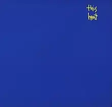 A blue background with the words "This Heat" written in small, yellow handwritten font in the top-right quarter of the image.