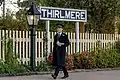 Thrilmere Station Sign with uniformed volunteer