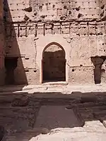 The former reception hall and throne room inside the western pavilion, the Qubba al-Khamsiniya. In the foreground are the remains of a rectangular water basin covered in zellij mosaic tilework.